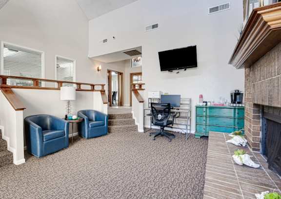 a living room with a fireplace and a flat screen tv