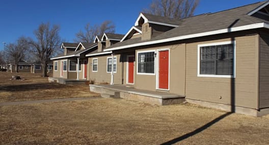 a row of houses with red doors