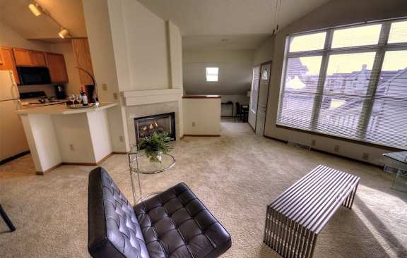 a living room with a couch and a fireplace