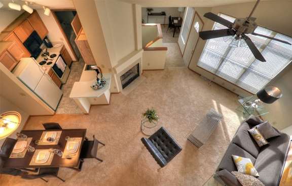 an overhead view of a living room with a ceiling fan