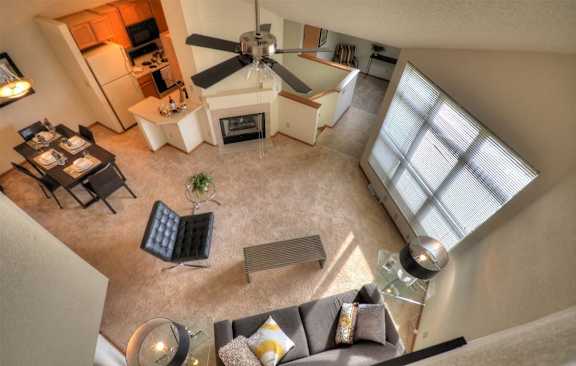 an overhead view of a living room with a ceiling fan