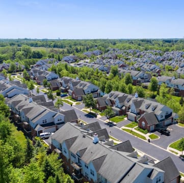an aerial view of a neighborhood with rows of houses