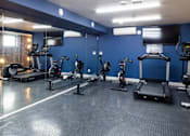 Thumbnail 7 of 8 - a room filled with lots of different types of exercise equipment