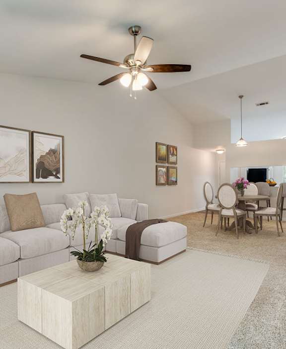 A living room with a couch, coffee table, and a ceiling fan. at Dothan Farms, Dothan, AL, 36305