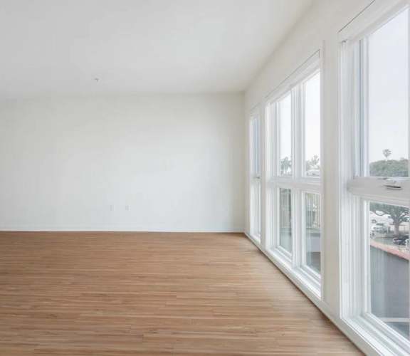 A room with wooden floors and white walls.