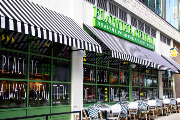 a restaurant with black and white striped awnings
