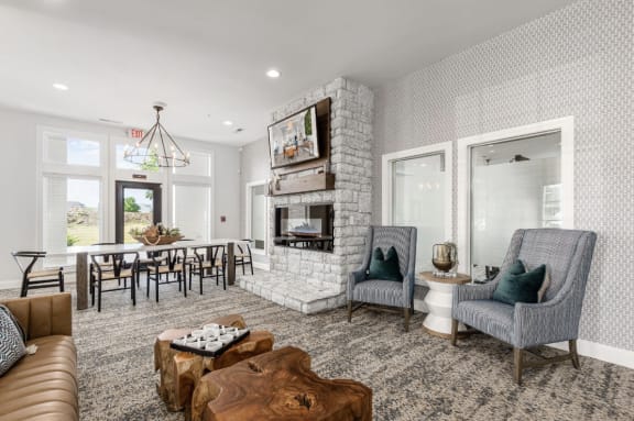 a kitchen and dining room with a table and chairs