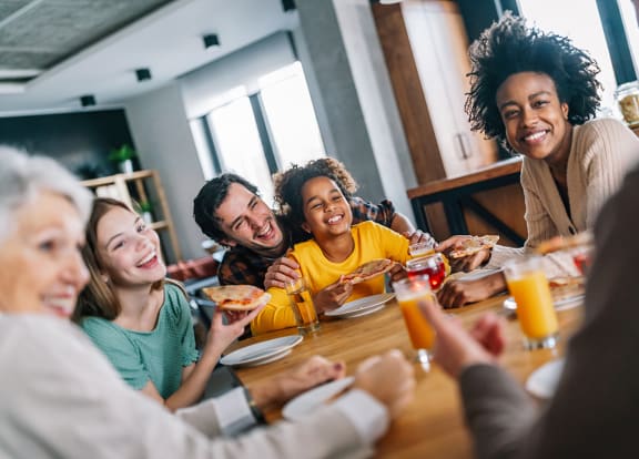 Lifestyle photo of family laughing at home at Monterey Pointe, Homestead, FL