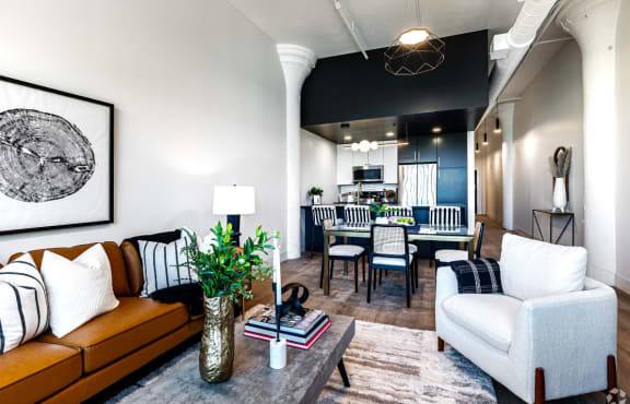 a living room and dining room with a couch and a table