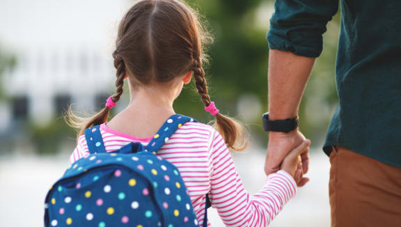 A Girl with a Backpack at Mission Gate in Plano, TX