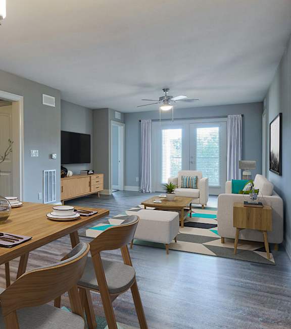 A living room with a kitchen area in the background at Mode at Melbourne, LLC Apartments, Melbourne, FL, 32901