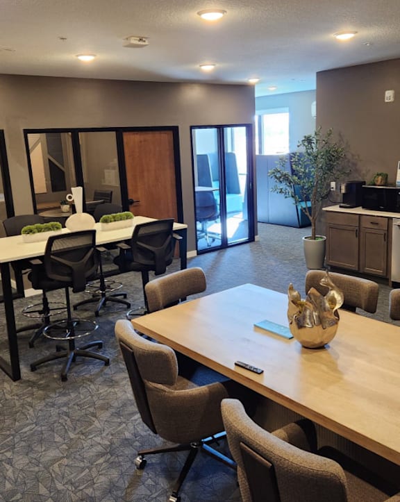 a living room with a couch a chair and a table at Bella Rose Apartments, Hudson