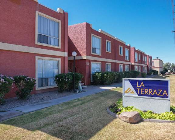 a building with a la terra sign in front of it