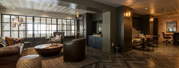 a room with a couch chairs and a coffee table