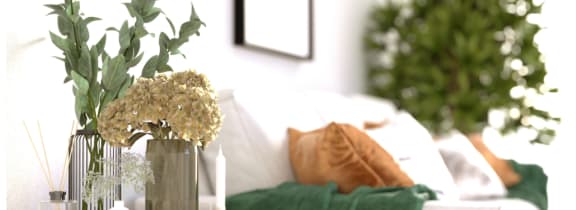 a vase with flowers on a table in a living room