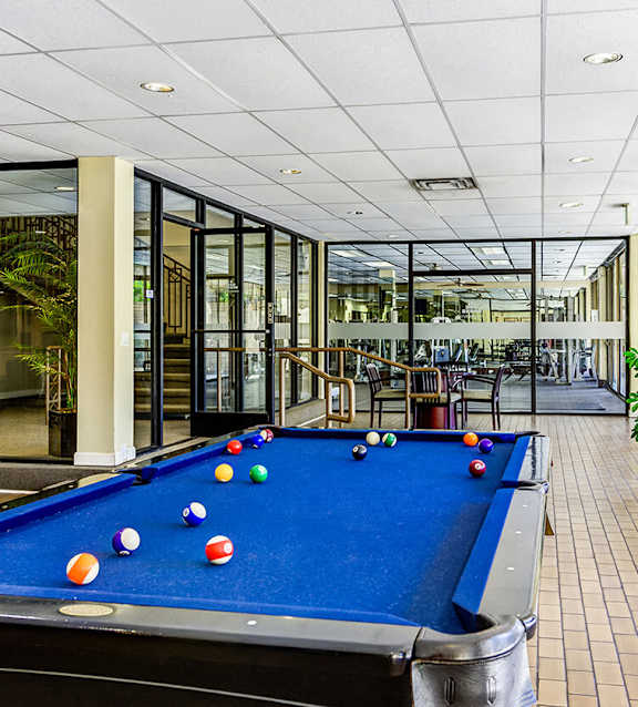 A pool table with balls set up in the middle of it.