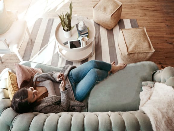 Woman laying on couch