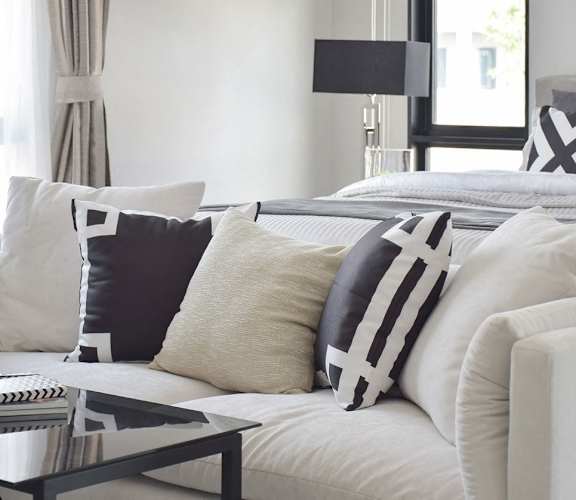 White couch with decorative pillows