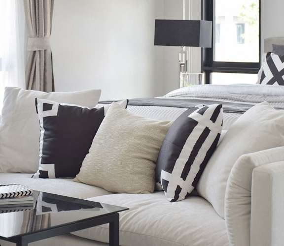 White couch with decorative pillows