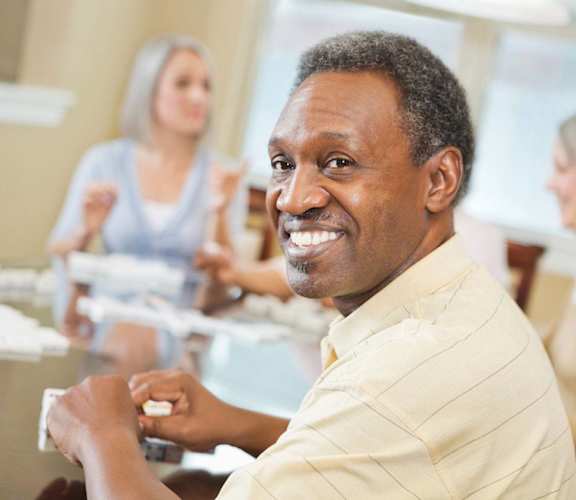 Elderly African American man play games