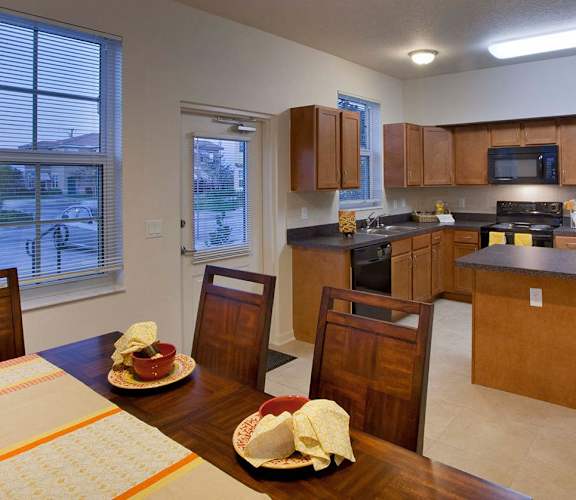 Dining area and kitchen, Northpark at Scott Carver Apartments Miami, FL