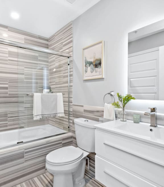a bathroom with a white toilet next to a bathtub at The Washington at Chatham, Pennsylvania