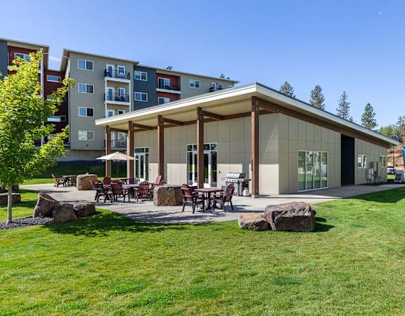 A modern building with a covered patio area in front.