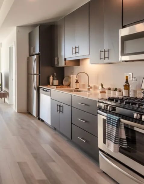 a kitchen and living room in an apartment