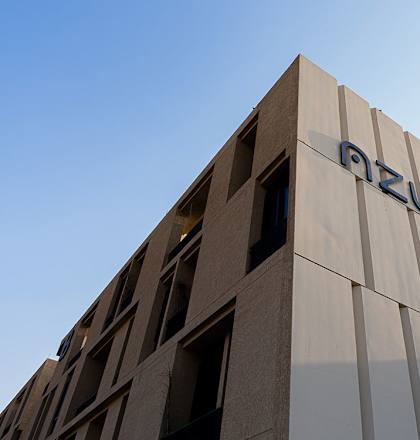 A modern building with the word "OZURE" on the side.