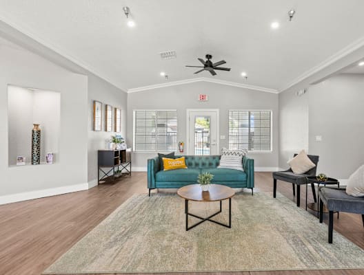 a living room with couches chairs and a coffee table