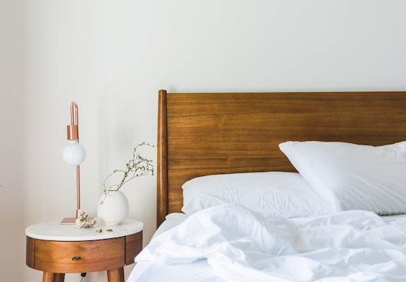 Model Bedroom with End Table and Lamp