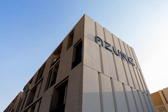 A modern building with the word "OZURE" on the side.