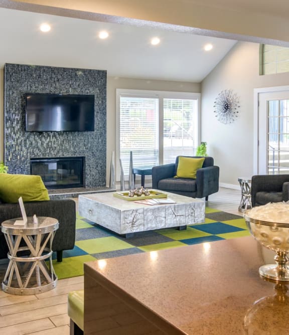 the preserve at ballantyne commons clubhouse with living room and fireplace