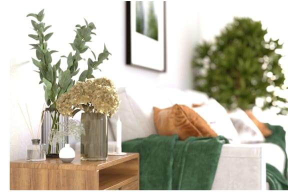 a vase with flowers on a table in a living room