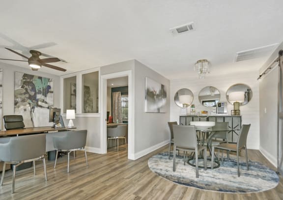 the clubhouse with leasing offices and resident refreshment bar at The Oasis Apartments in Daytona Beach, FL