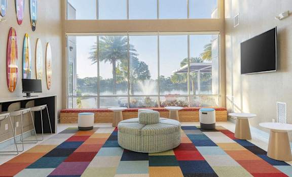 a room with a view of a water fountain and a large window