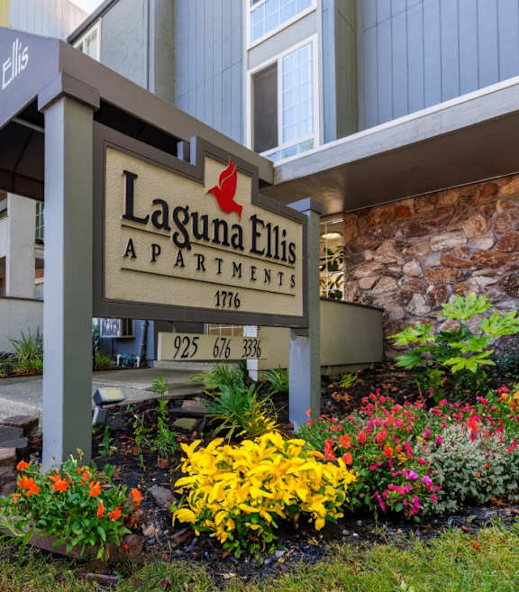 The image shows the front of the Laguna Ellis apartment complex.