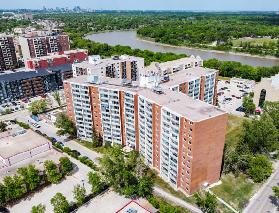 a view from above of a large apartment complex with a river in the background