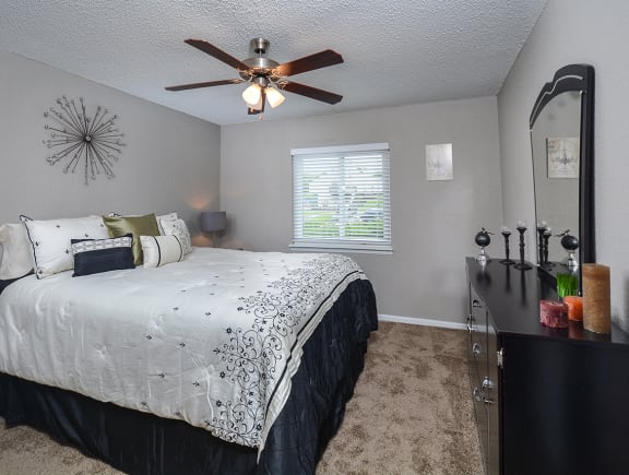 Furnished Large Bedroom with Ceiling Fan and Double Window