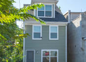 Thumbnail 4 of 6 - the front of a house with a truck in front of it