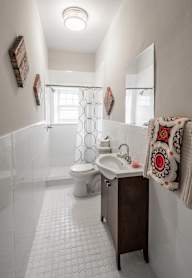 A white toilet sits next to a sink in a bathroom.