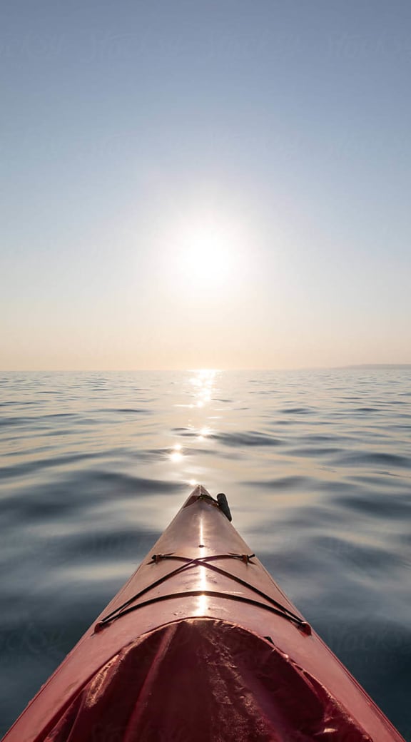 a kayak in the middle of the ocean