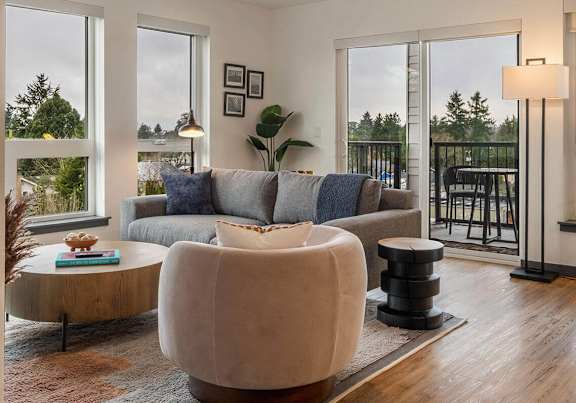 a living room with a couch and a coffee table and a rug at Elevation16 Apartments, Seattle