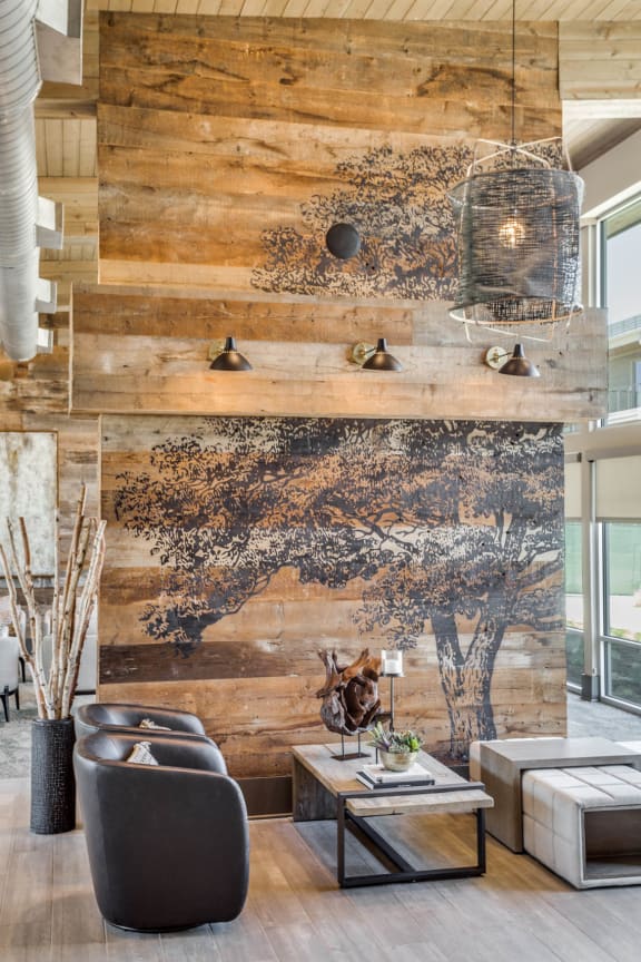 a living room with a tree mural on the wall at Trailhead, Austin, TX