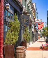 a city street with a row of shops and buildings at The Press/321, Detroit MI