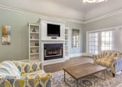 Thumbnail 11 of 25 - Resident lounge center with television