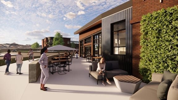 a rendering of a patio area with people walking around and tables and chairs in the background