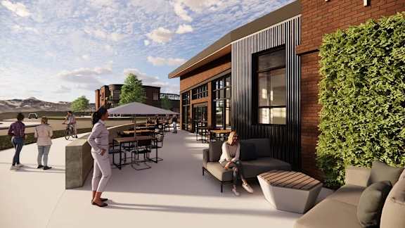 A modern outdoor seating area with people enjoying the space.