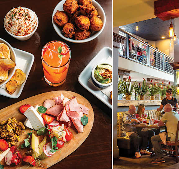A restaurant with people dining and a variety of food displayed.