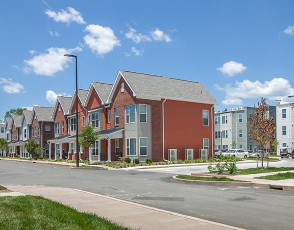 a row of apartment homes on a city street